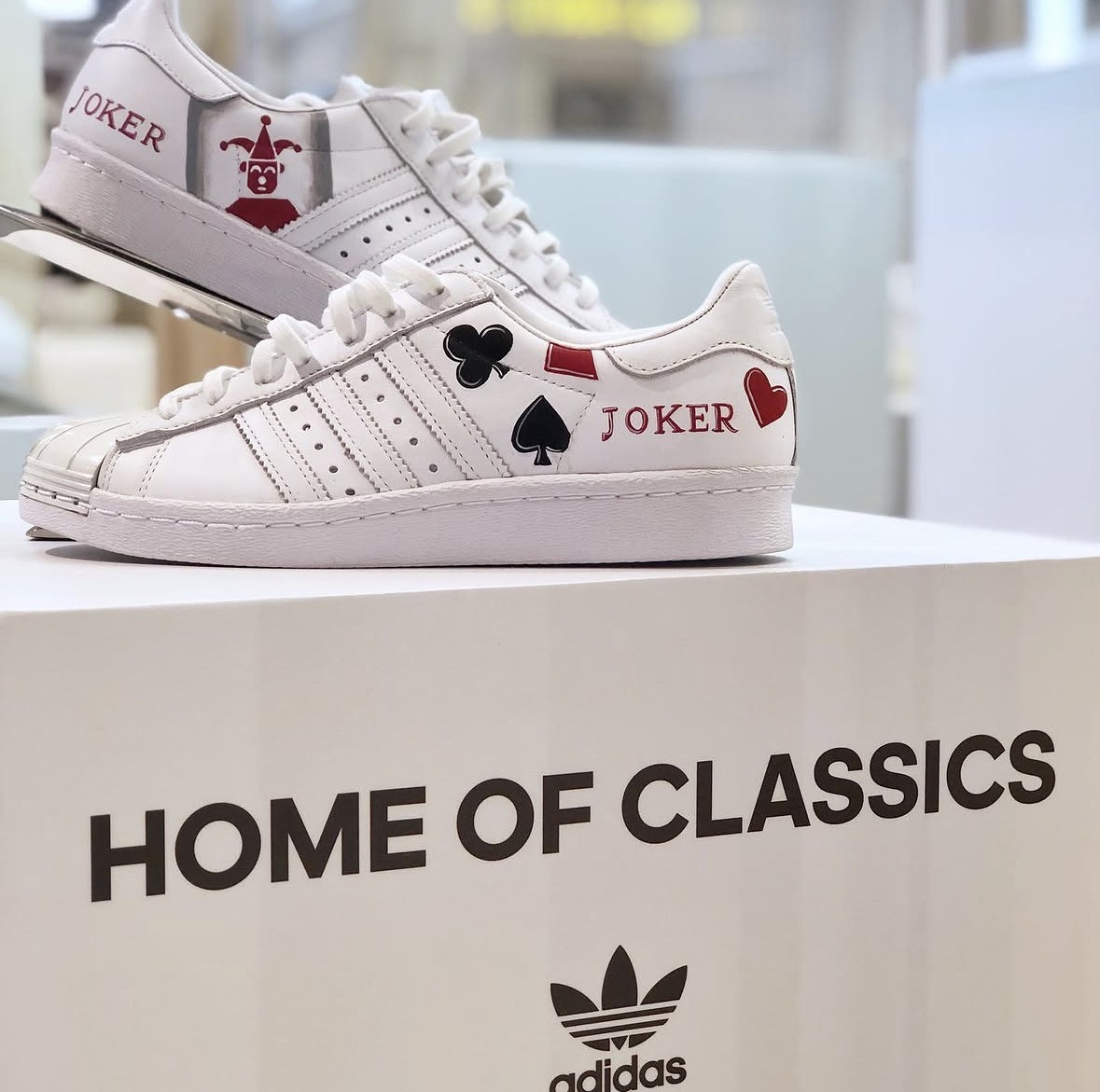 Stan Smith painted with playing-card suits and 'Joker'