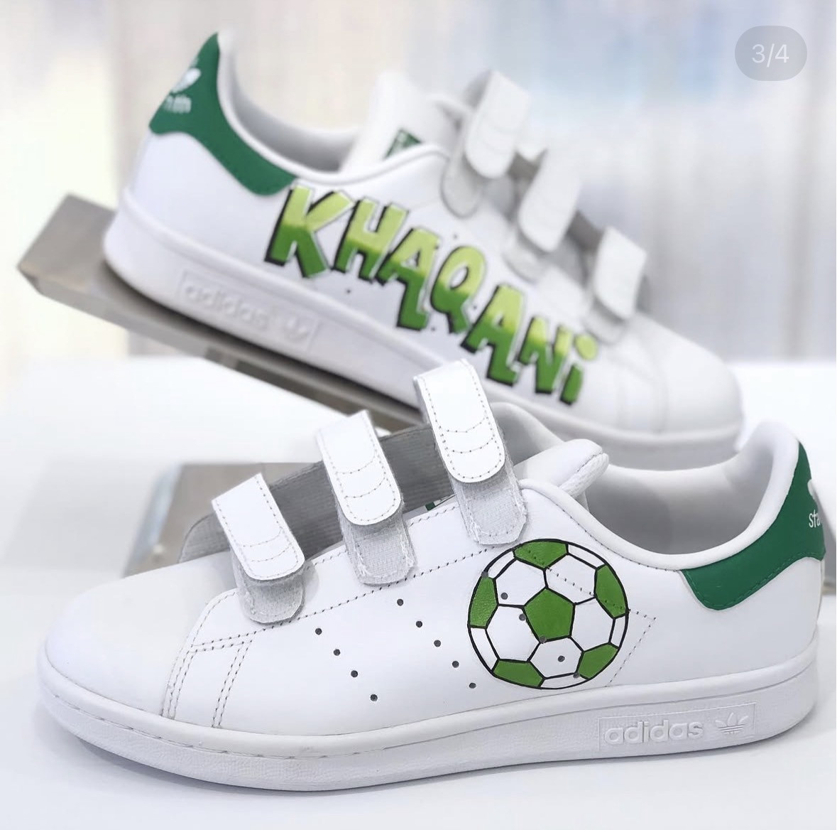 Stan Smith with a name and a football