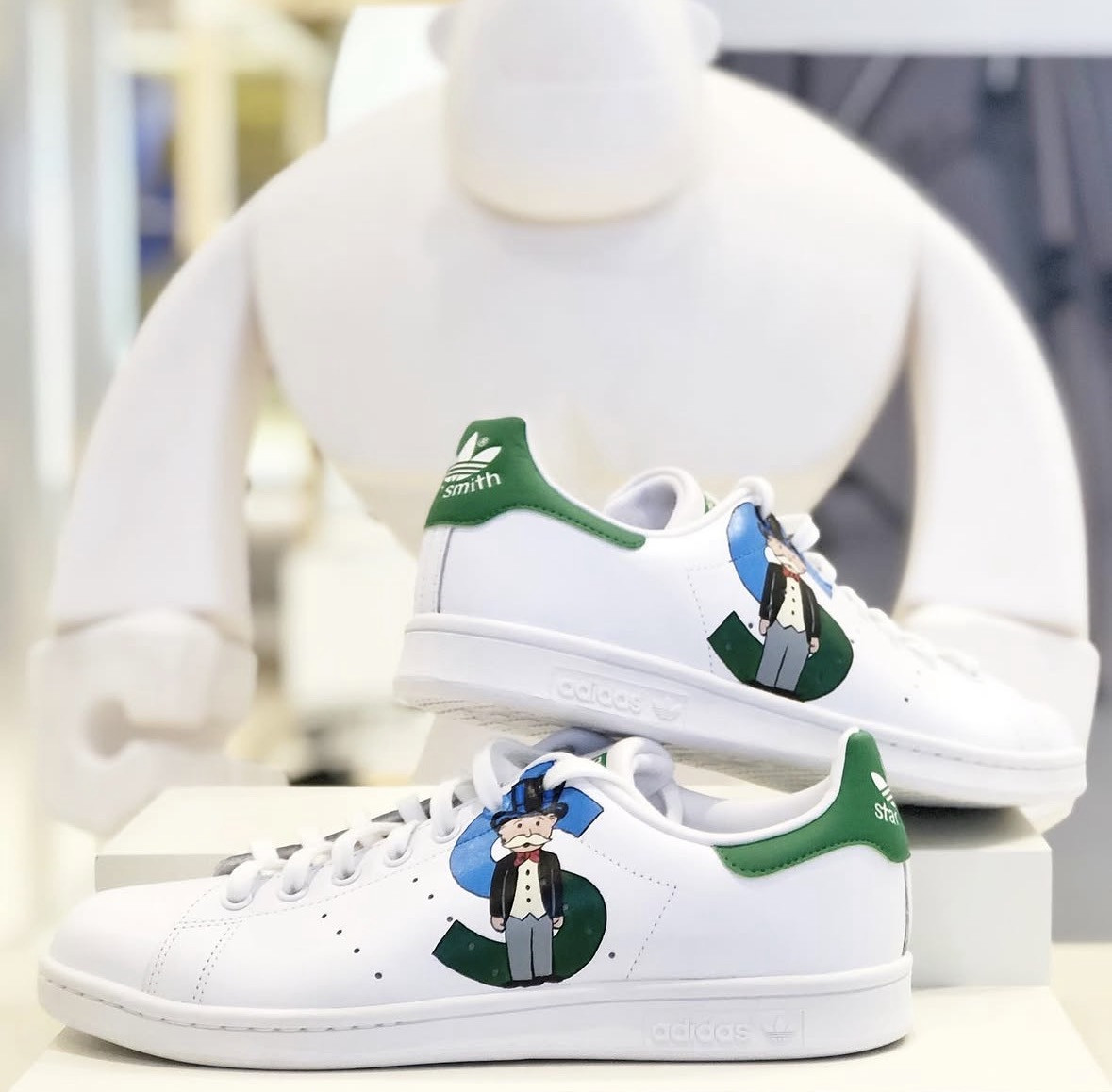 Stan Smith painted with a dollar-sign figure