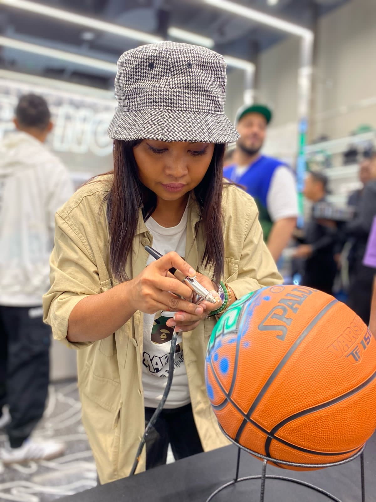 Airbrushed basketballs with 'Dxb' lettering