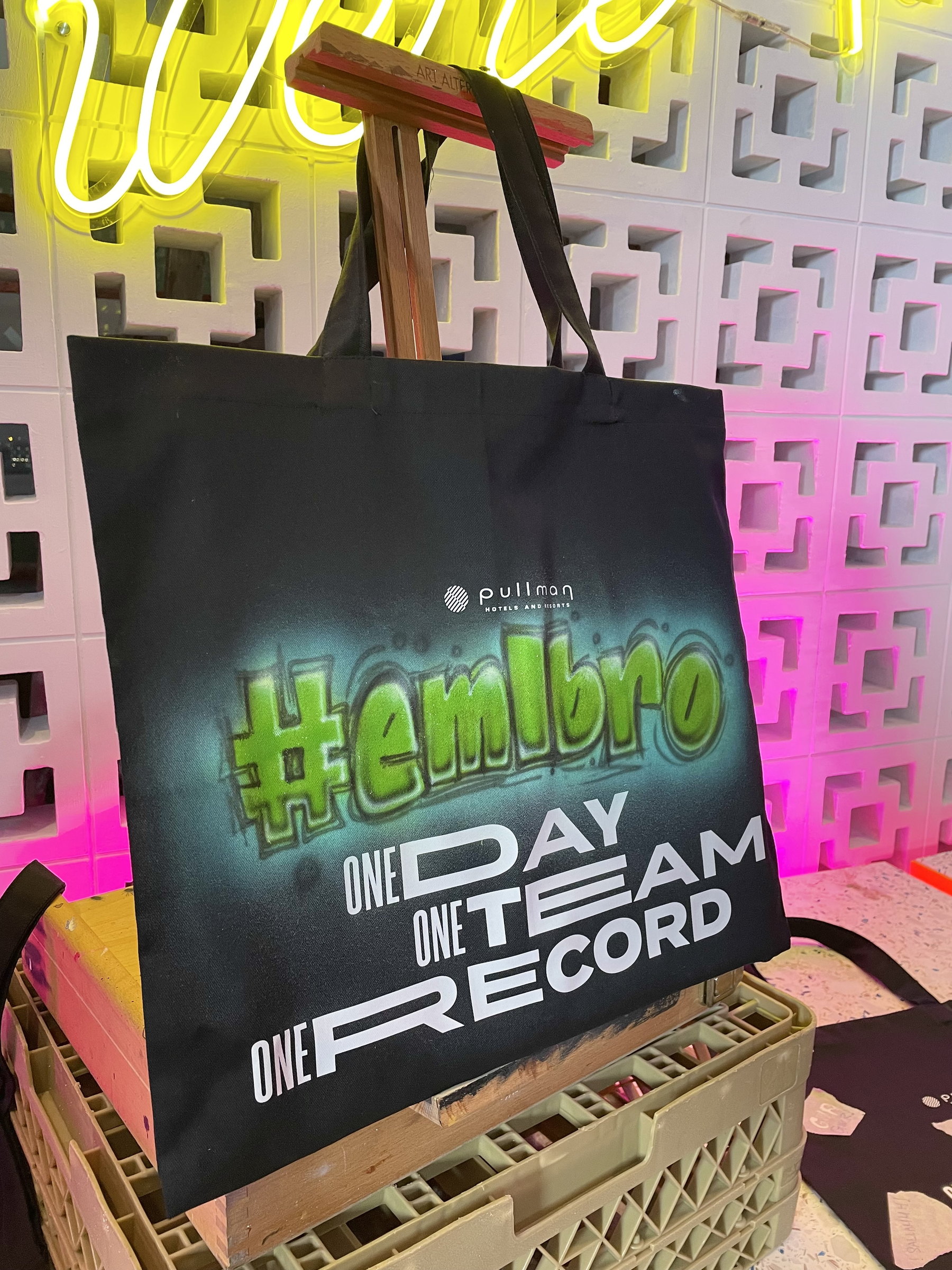 '#embrace' airbrushed on a tote bag
