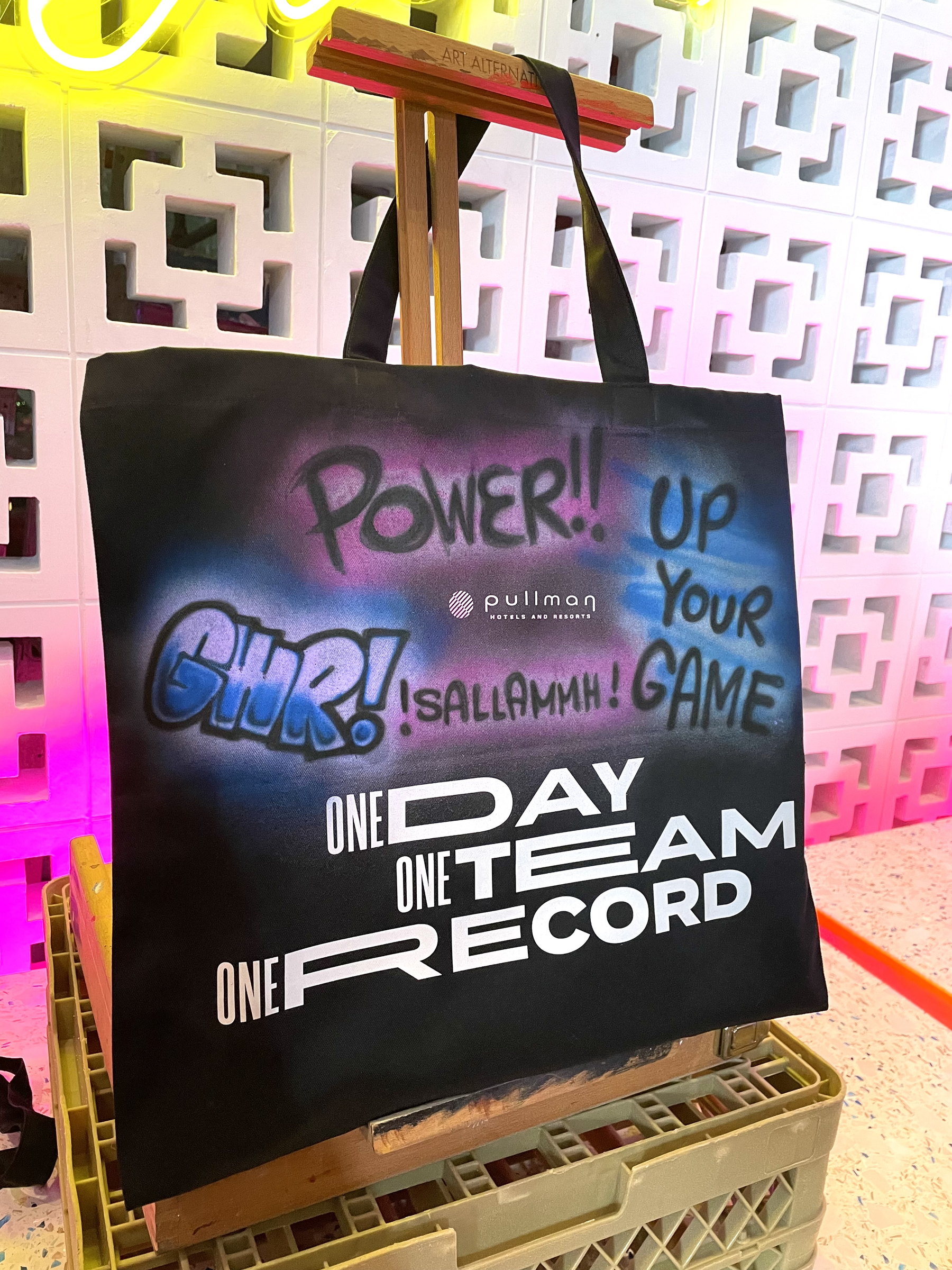 'Power up' airbrushed on a tote bag