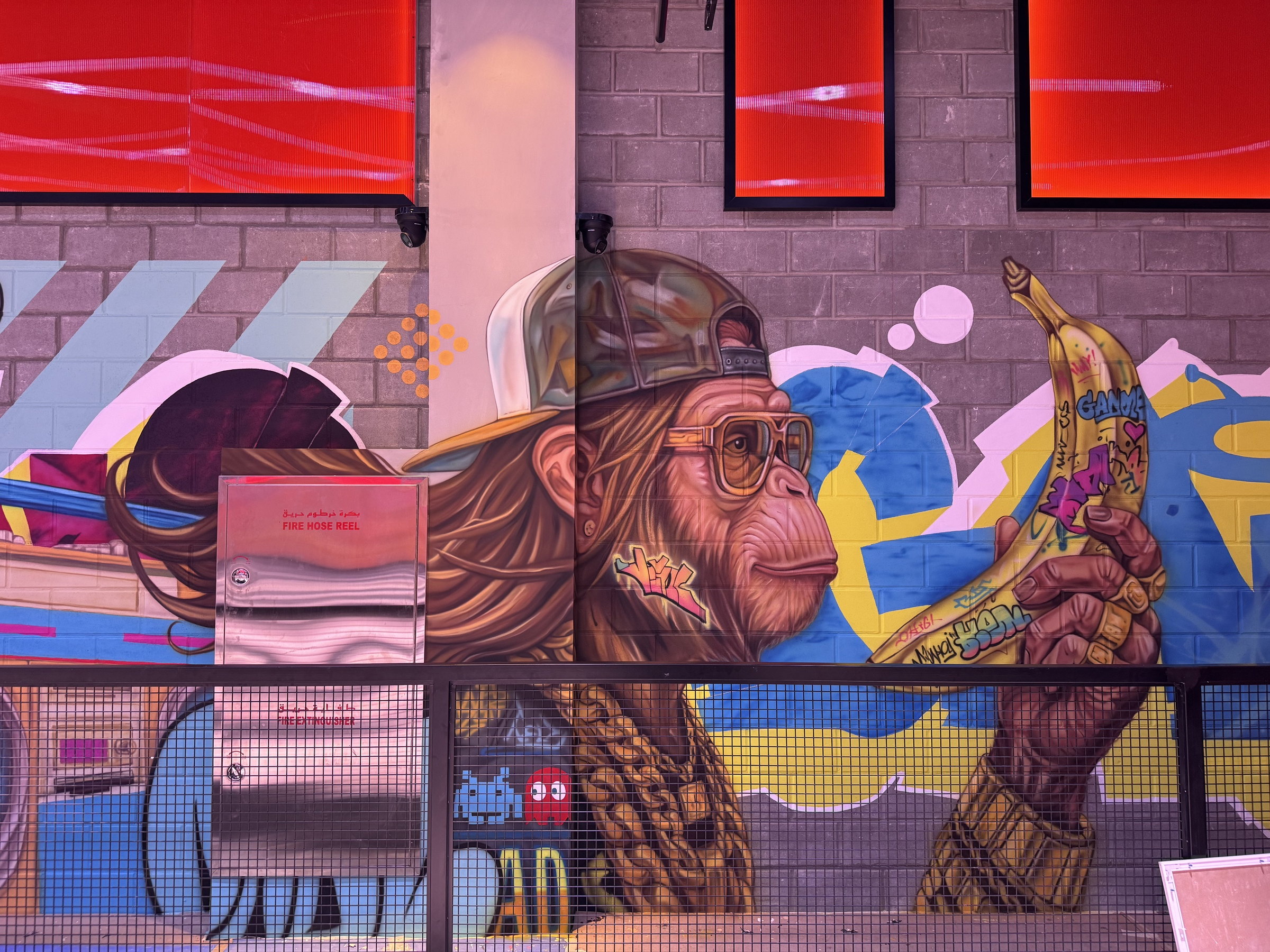 Wide view of the Motor City mural under red light