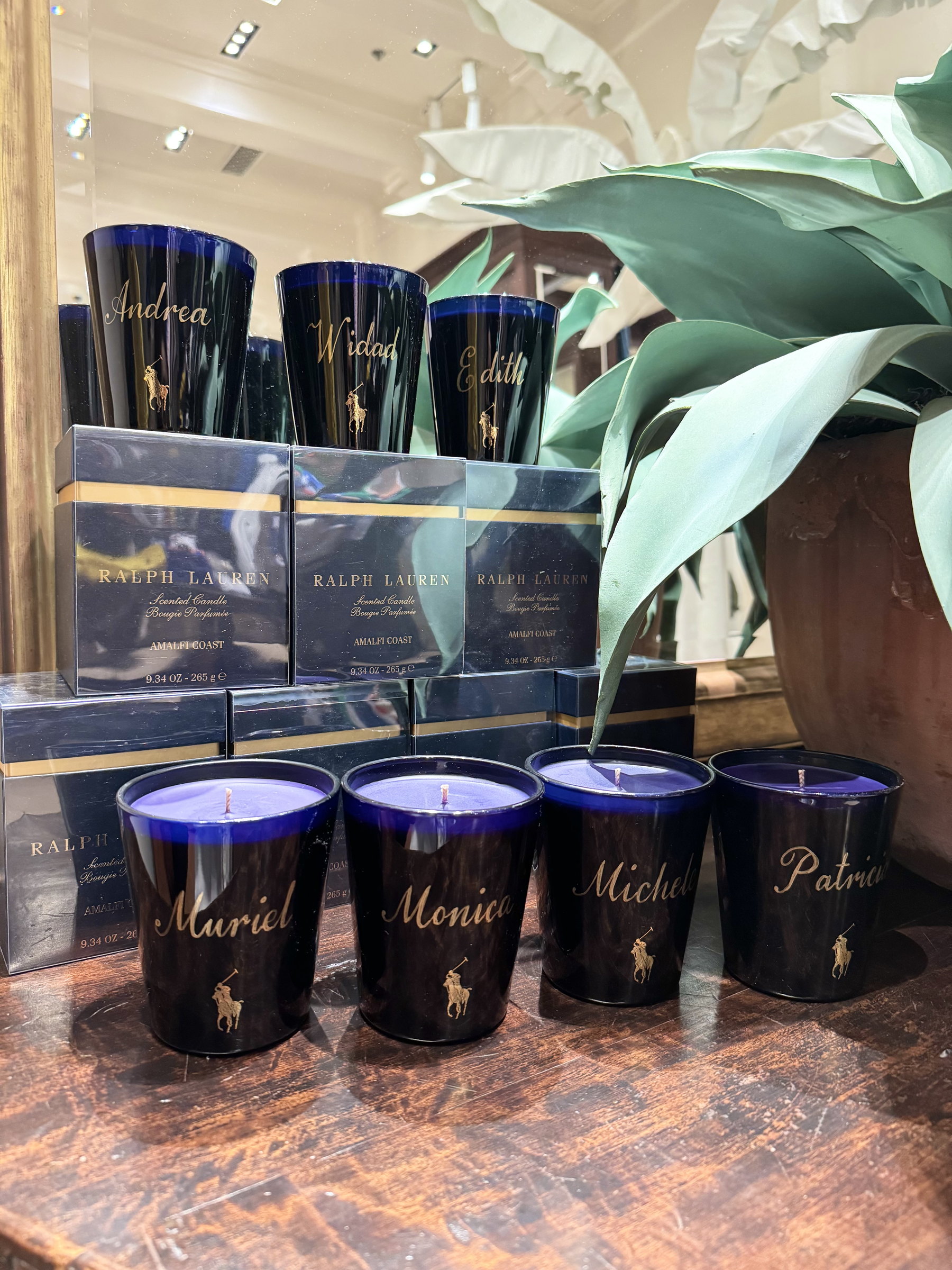 A row of personalised black candle jars