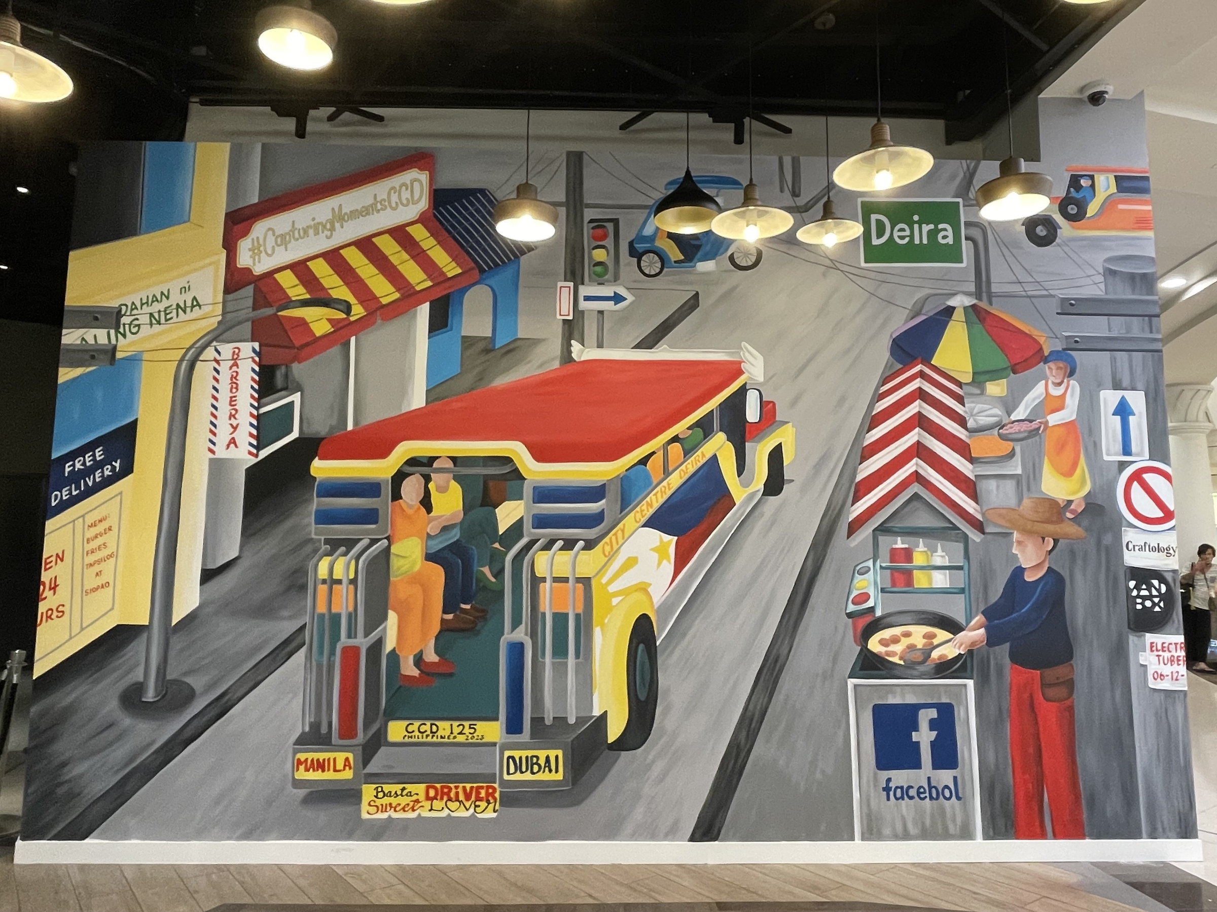 Wide view of the live-art wall in the City Centre Deira atrium