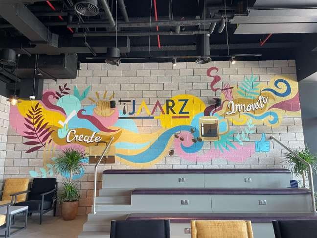 Hand-lettered 'Tjaarz' wall at La Vena Cafe