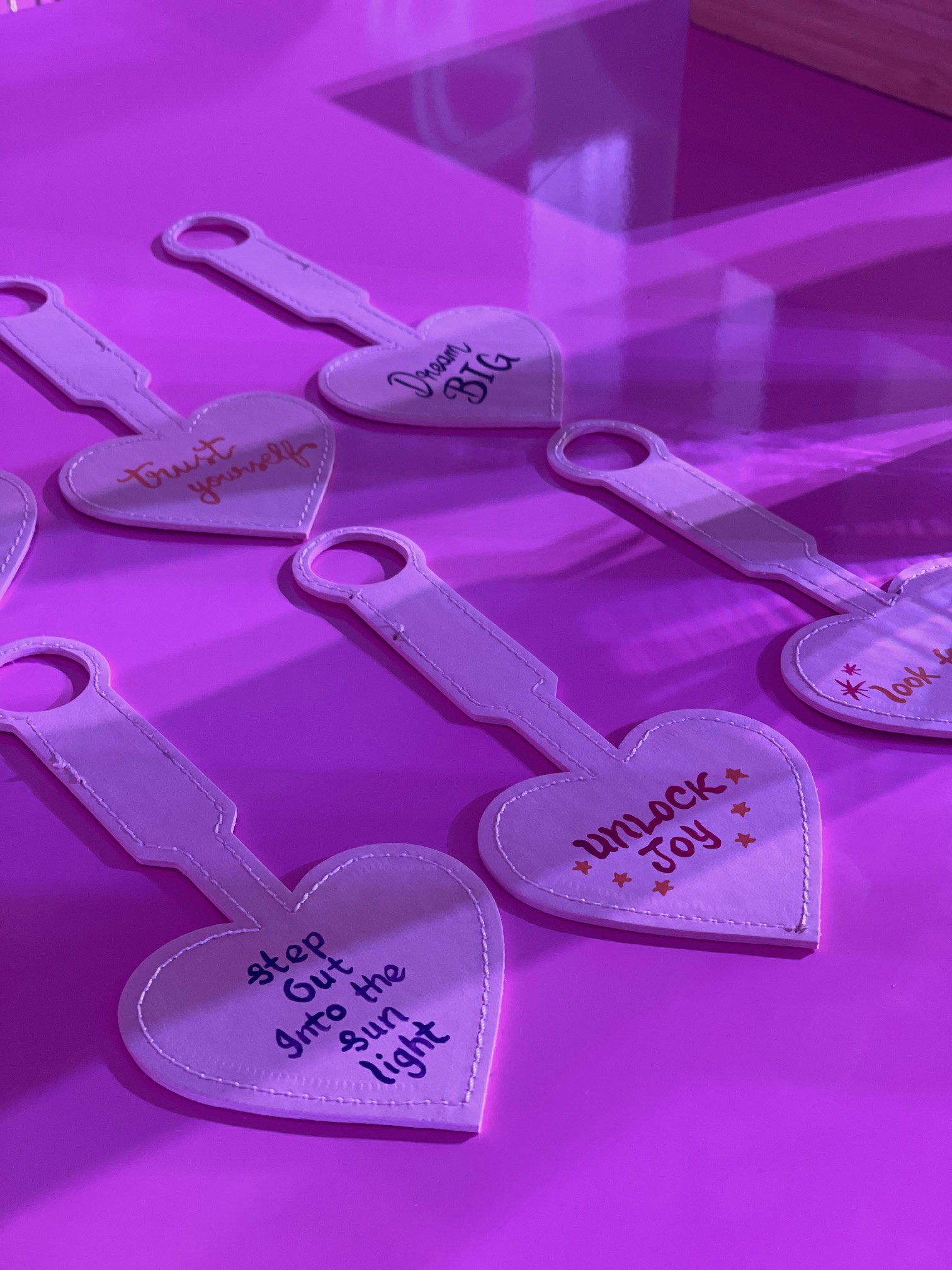 Pink tags with names in gold