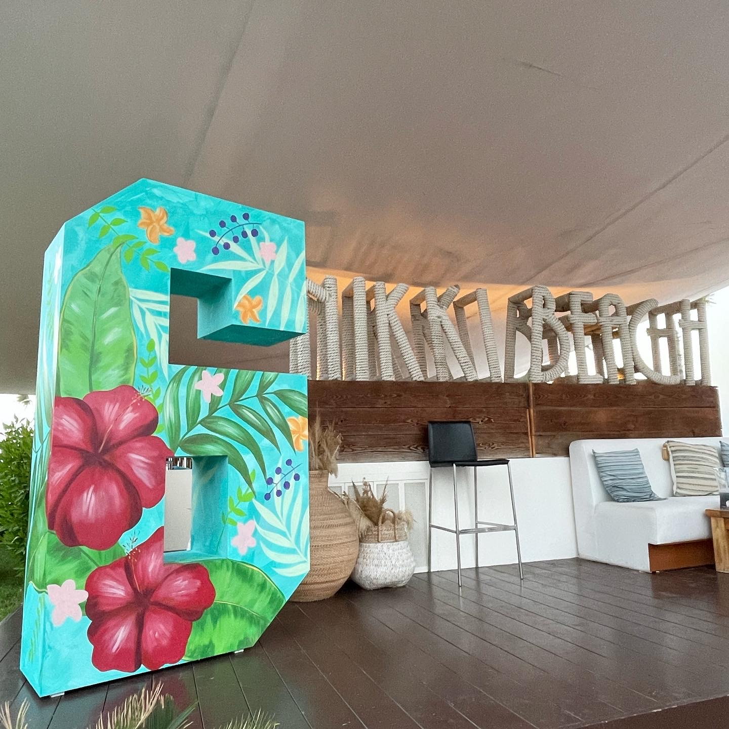 Painted '6' with hibiscus flowers at Nikki Beach