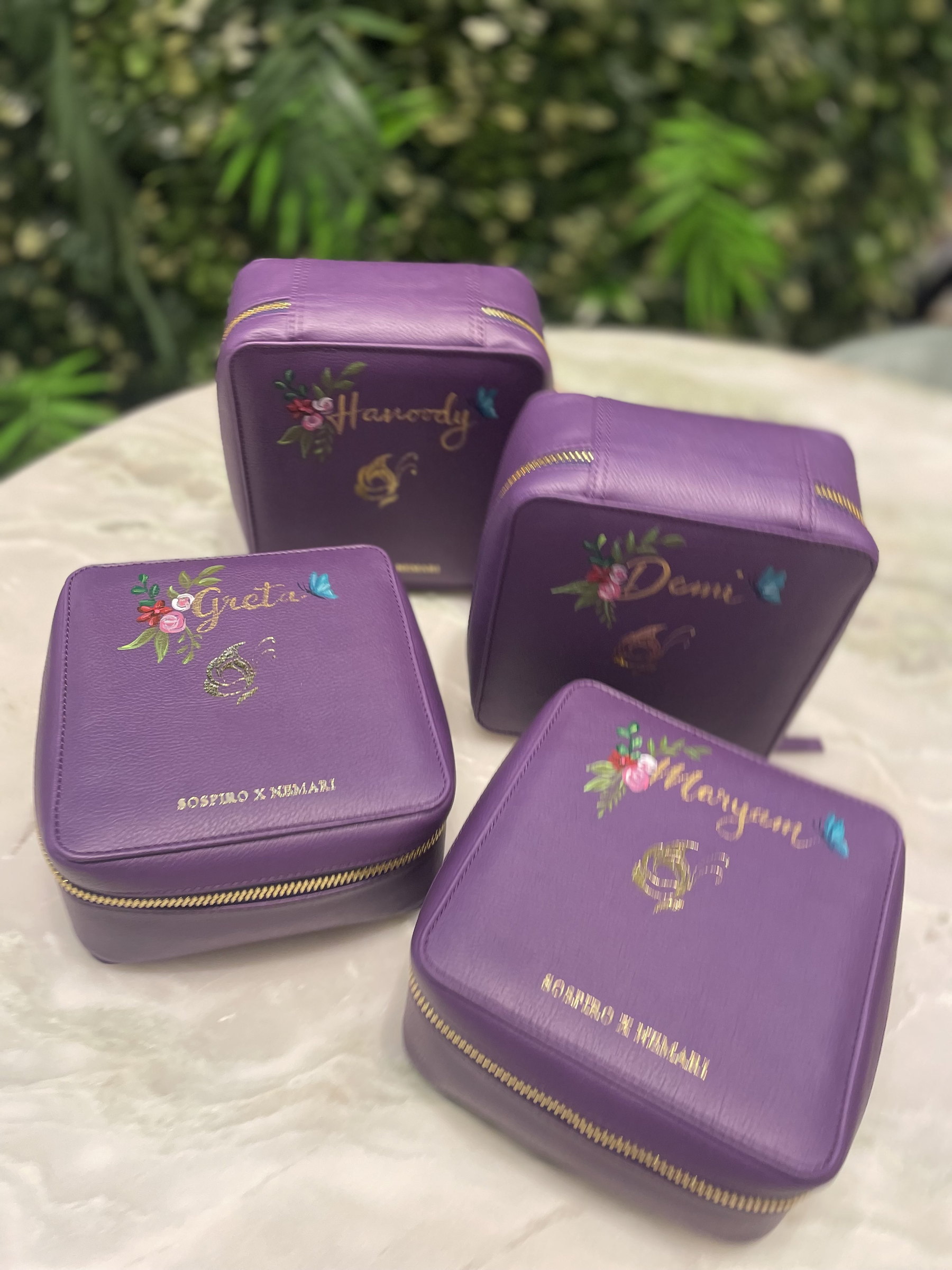 Three personalised purple pouches