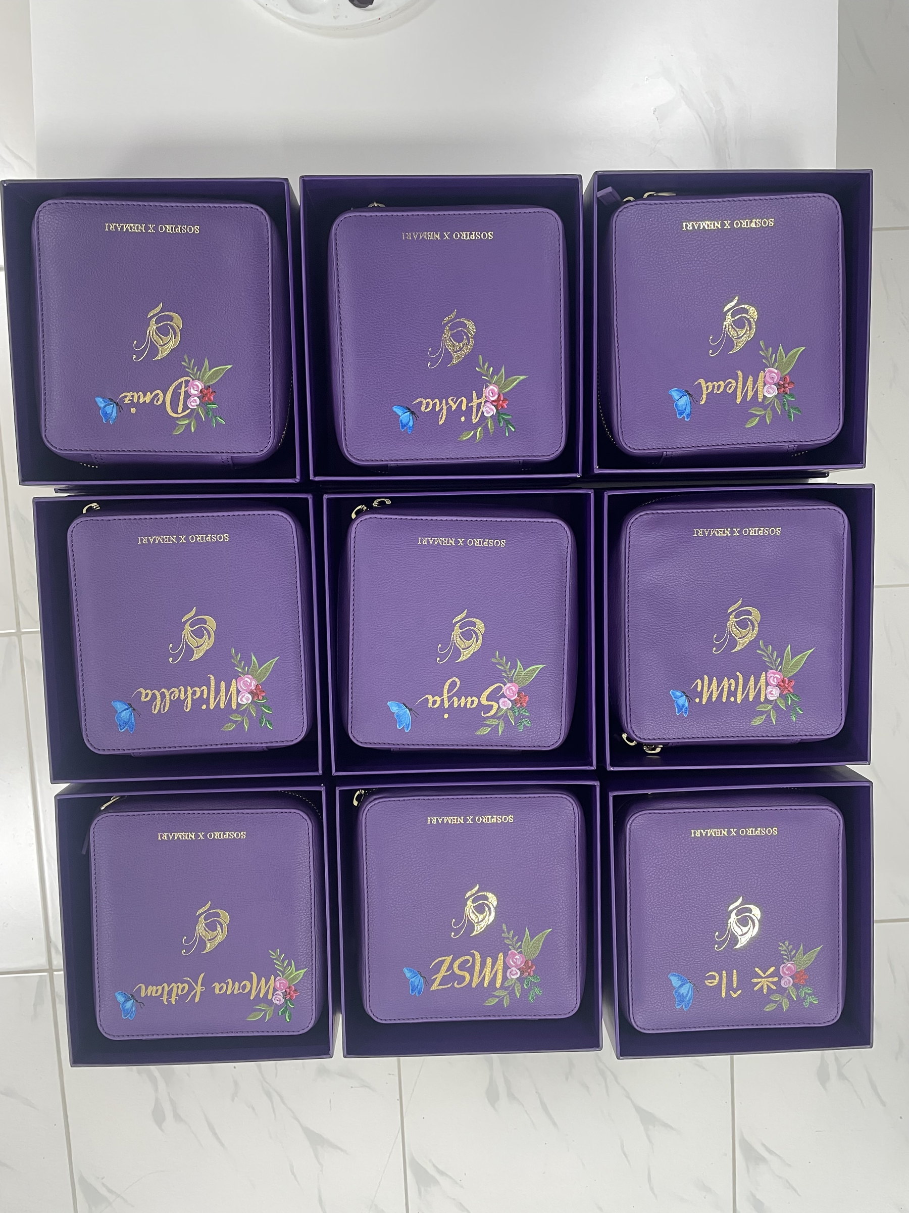 A grid of personalised purple pouches