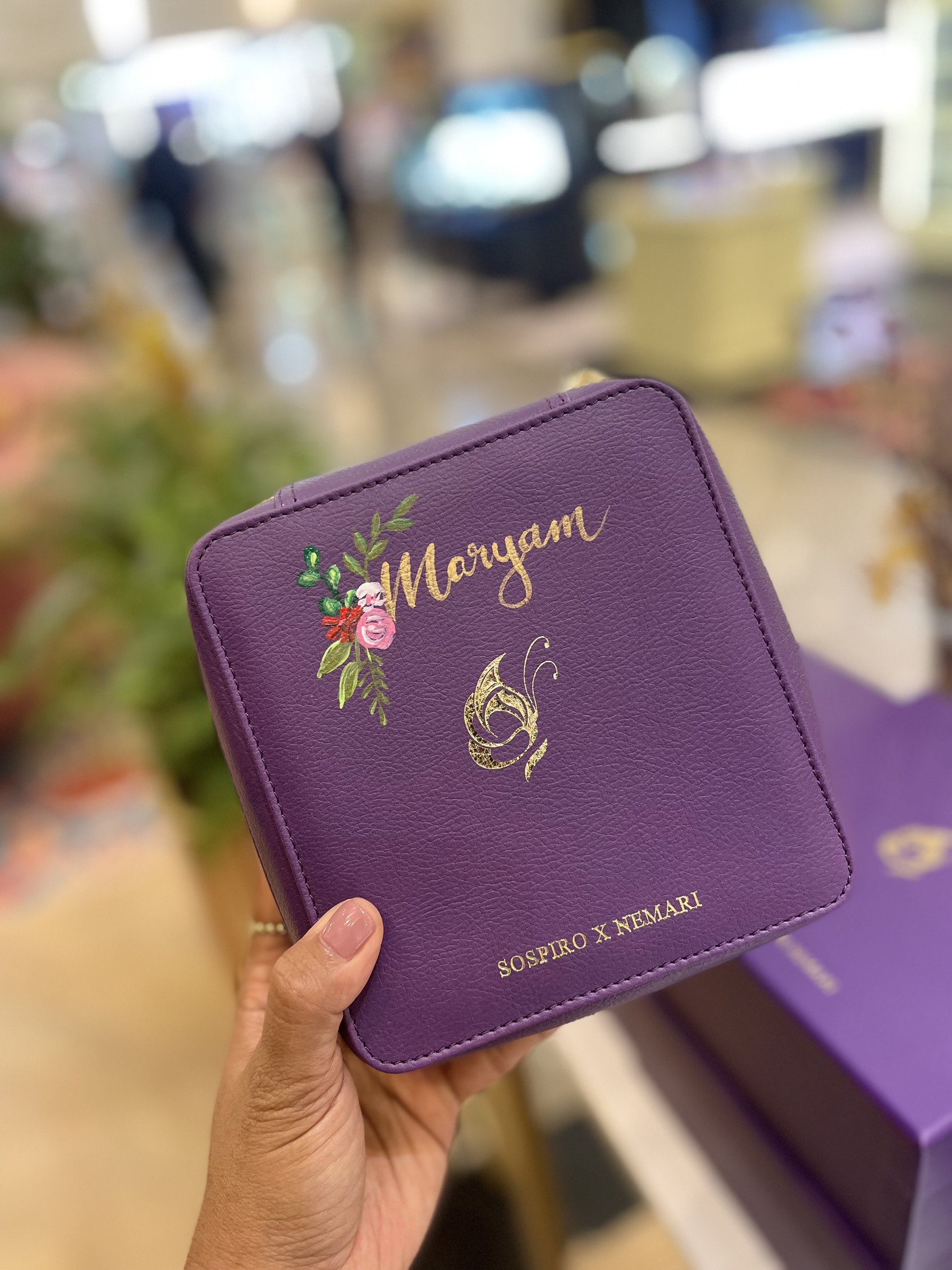 'Morgan' painted on a purple pouch