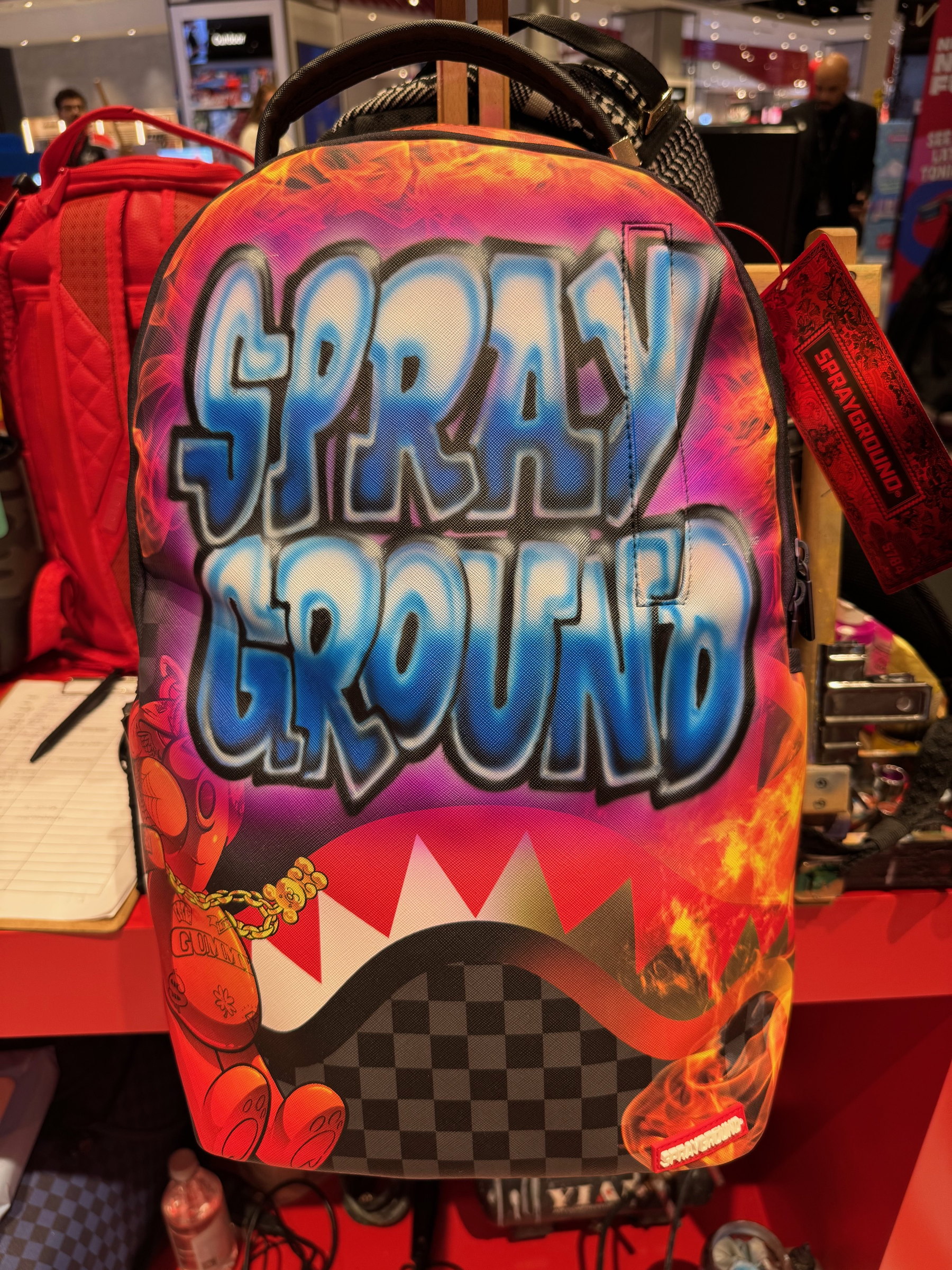 Airbrushed 'Sprayground' backpack on display