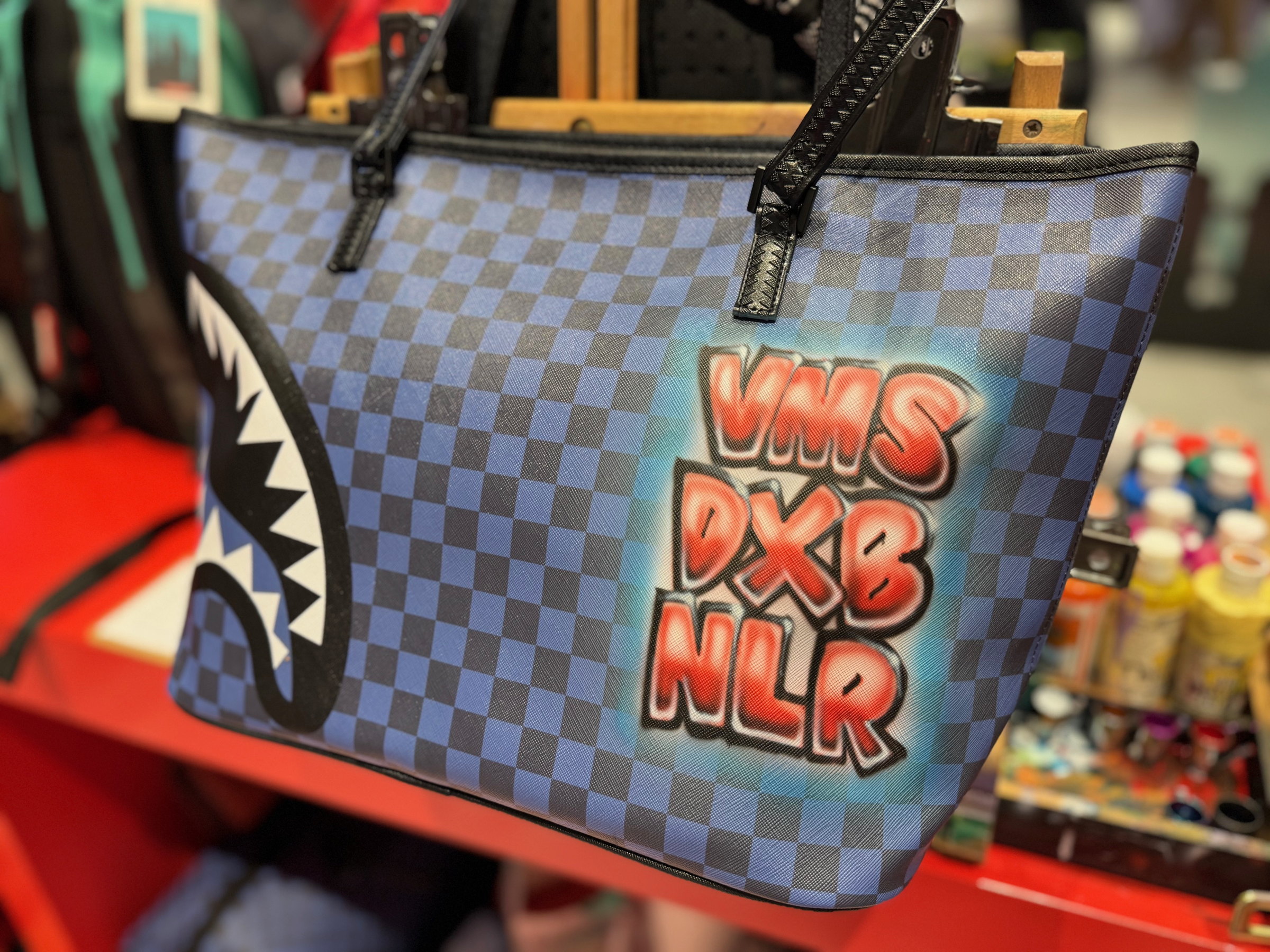 Airbrushed shark-mouth backpacks at Virgin Megastore