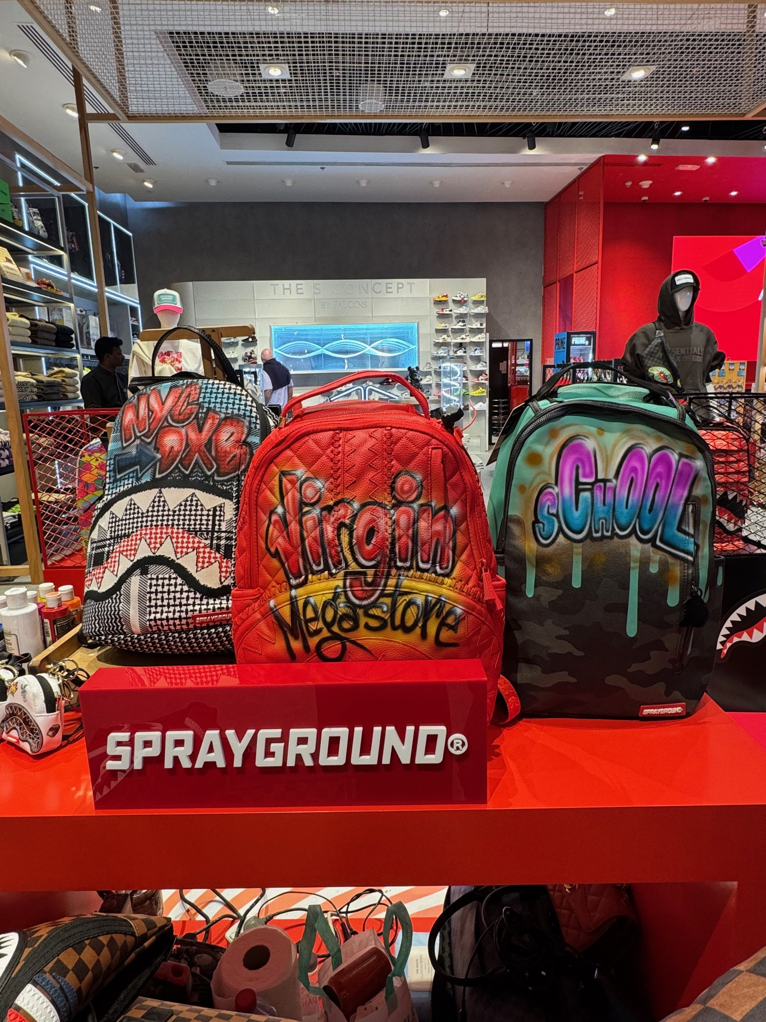 Airbrushed Sprayground tote on the counter