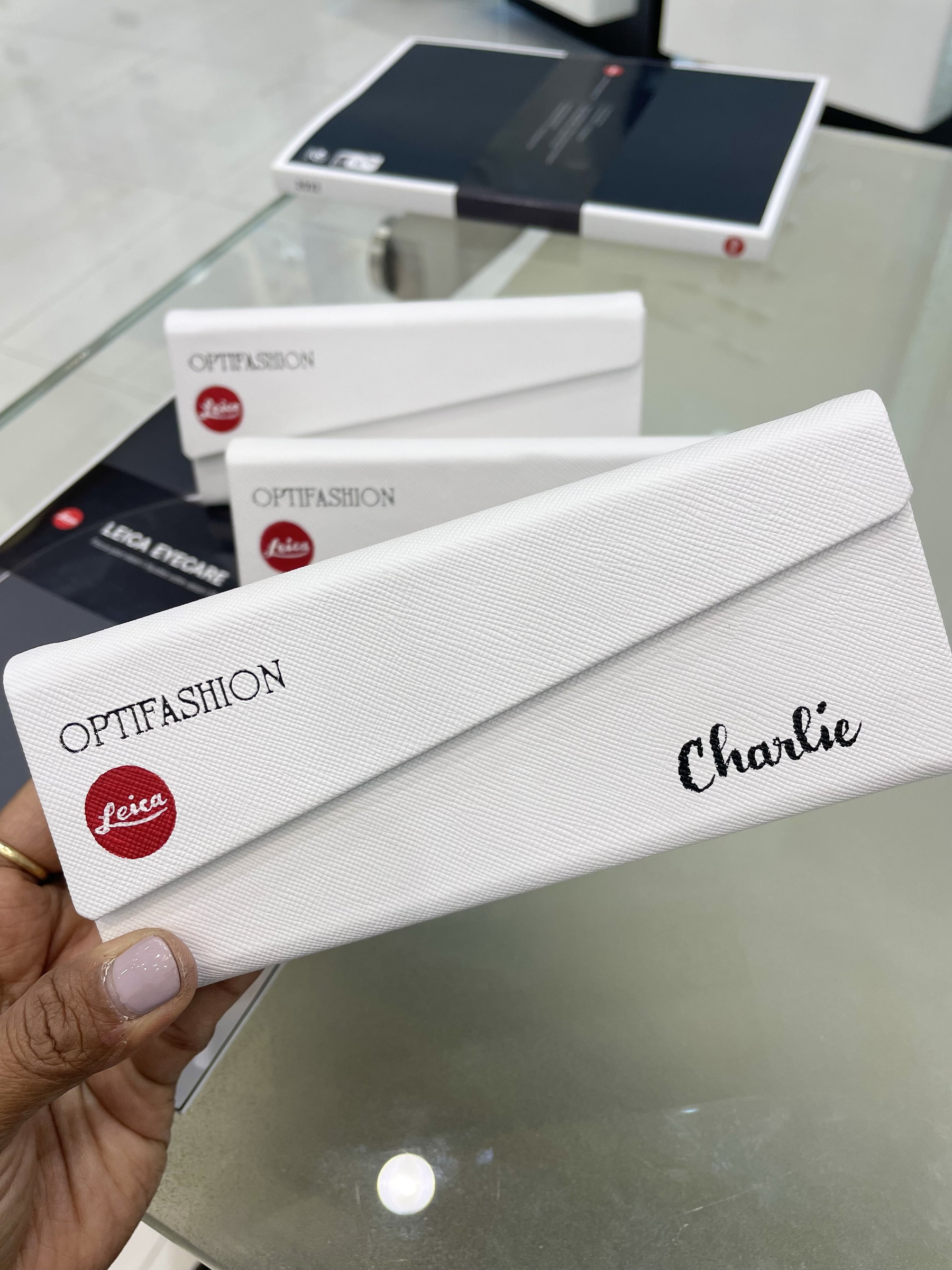 'Charlie' lettered on a sunglass case