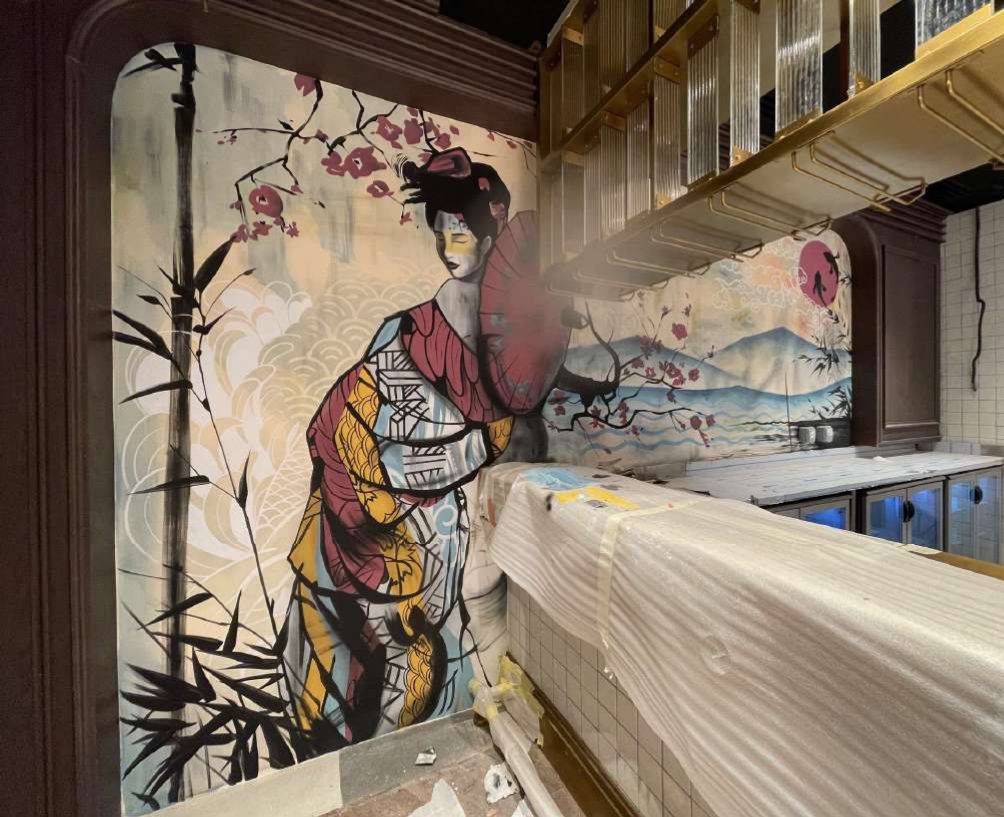 Dining room at Sushiyaki wrapped in a hand-painted Tokyo street scene