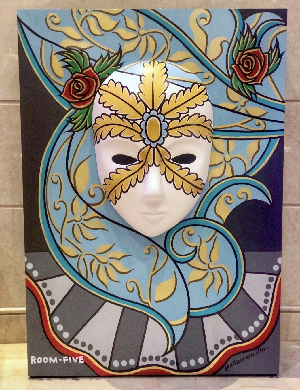 Painted carnival mask with a sunburst headdress at the Dubai Festival for Youth Theatre